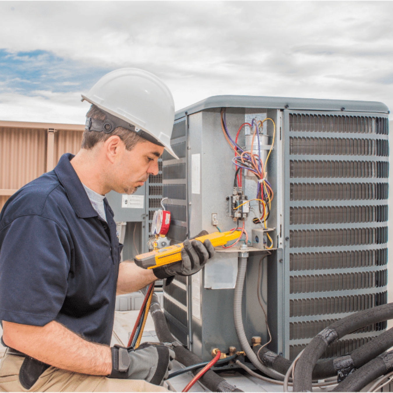 Kitchener HVAC Pros HVAC technician servicing a system